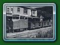 1949: Lister Autotruck 'Gwril' with original steel body, in the original station road at Fairbourne, with a train of Basset-Lowke 4-wheel carriages, from book 'Short History of Fairbourne Railway' - Bill Hyde collection