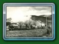 1950's: 'Count Louis' with train of Bassett-Lowke 4-wheel carriages steams away from Fairbourne, an undated postcard - Bill Hyde collection
