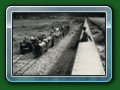 1951: The Passing Loop has been added and 'Dingo' with the articulated open set is on the down train as it passes 'Count Louis' with 7 of the Bassett-Lowke (all of them?) 4-wheel carriages on the up train, from book 'Short History of Fairbourne Railway' - Bill Hyde collection