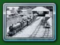 1958: 'Count Louis' and train of Bassett-Lowke 4-wheel carriages and ex-Hardwick Manor twin-bogie carriages waits to leave the new station. Just visible at the back of the running shed is the Traverser built by S.H Heywood & Co Ltd of Redditch Worcs, which arrived 1958 and was the only way to move the arriving loco from track one to the run round loop, from book 
'Short History of Fairbourne Railway' - Bill Hyde collection