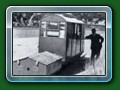 1953: Canteen coach mk1 with battery wagon (the Canteen had an ice cream fridge inside, the batteries kept it frozen for a day, they were recharged overnight at Fairbourne) at the Ferry, still no actual platforms, from book 'Short History of Fairbourne Railway' - Bill Hyde collection