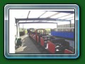 Glass ended 14-seat braked twin4-wheel bogie coach built by G & S 1950 for the Dudley Zoo Rly. Sold to Fairbourne Rly 1960. Painted red by Ellerton. Out of use 1985. Eventually sold to Austin Moss & moved to Windmill Farm Rly. 1996 Windmill Farm (c) Bill Hyde 