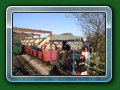 Glass ended 14-seat braked twin4-wheel bogie coach built by G & S 1950 for the Dudley Zoo Rly. Sold to Fairbourne Rly 1960. Painted red by Ellerton. Out of use 1985. Eventually sold to Austin Moss & moved to Windmill Farm Rly. With Gwril (ex Fairbourne Lister Autotruck) at Windmill Farm 1996 (c) Bill Hyde 